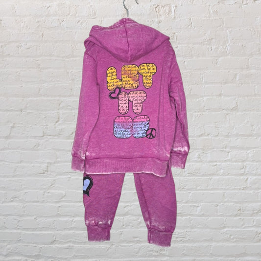Purple hoodie and pants set with 'Let It Be' graphic design on the back of the hoodie and heart and peace symbols.