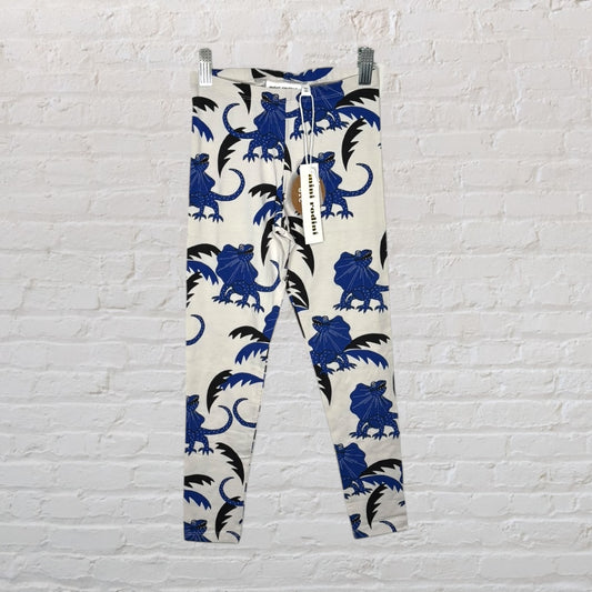 Unisex leggings with blue dinosaur print on a white background, brand new with tags from Mini Rodini.