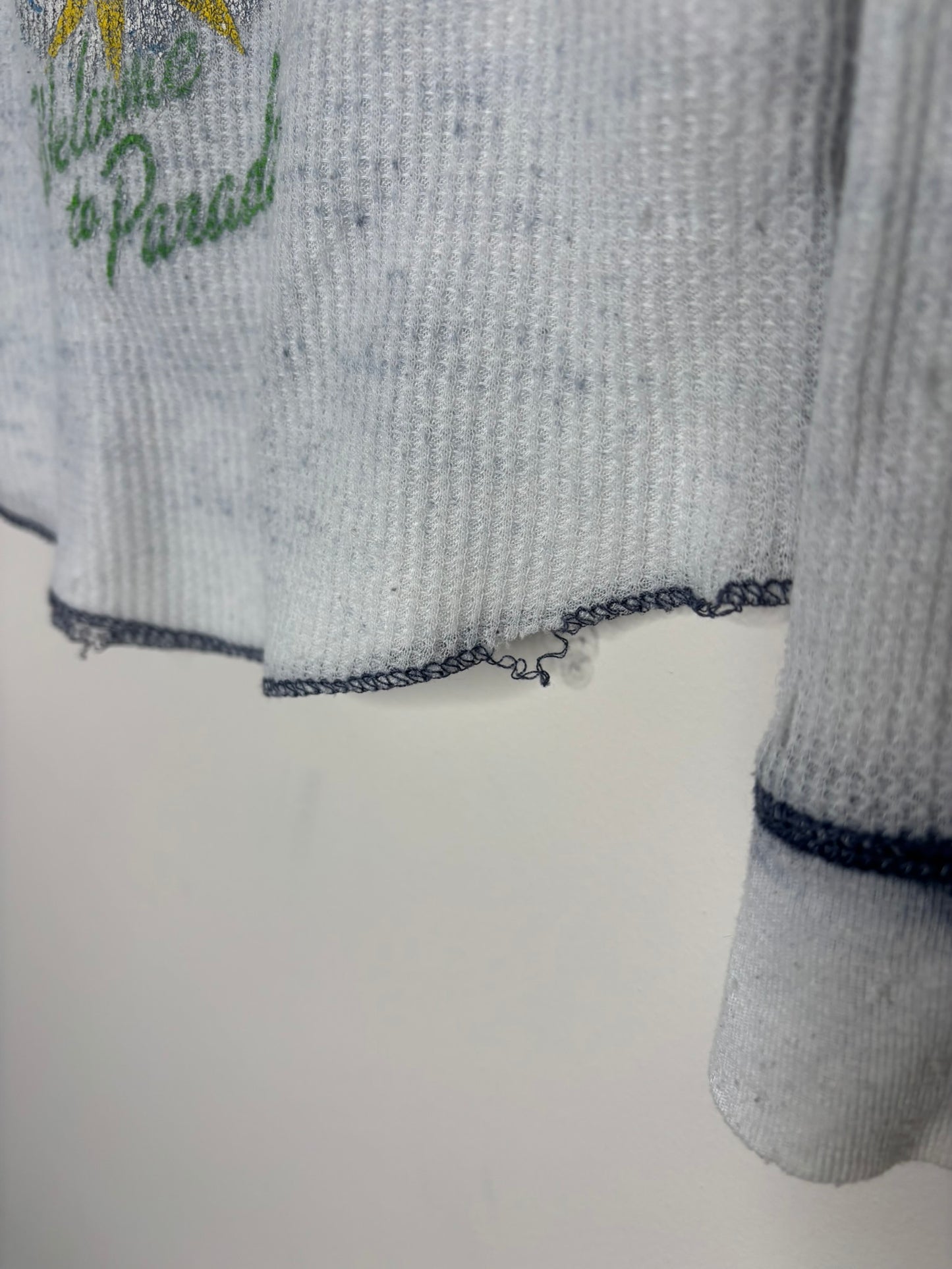 Gray thermal long sleeve shirt with Green Day 'Welcome to Paradise' graphic.