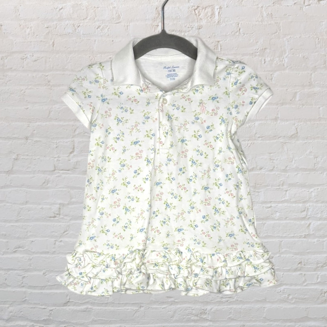 White Ralph Lauren polo shirt with floral print and ruffle hem design for kids.