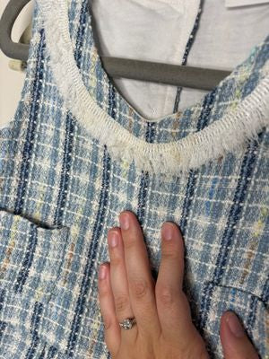 Blue and beige plaid two-piece outfit for toddlers with a sleeveless pleated top and matching pants.