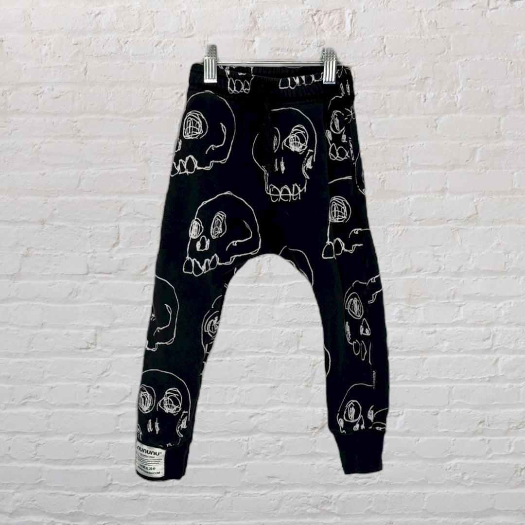 Black harem pants with white skull print, made by nununu.