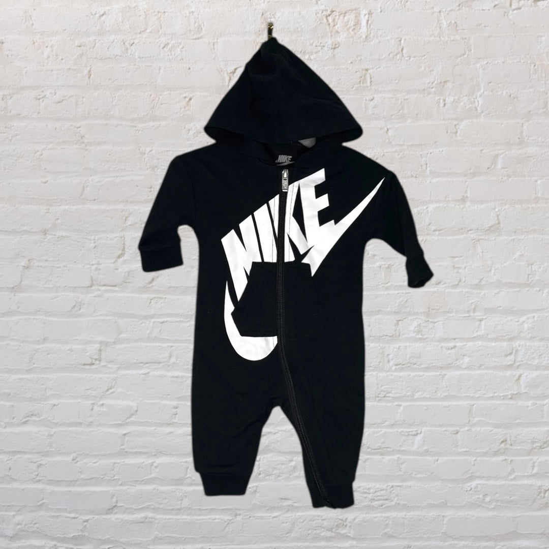 Black Nike hooded onesie with a large white Nike logo and zip closure.