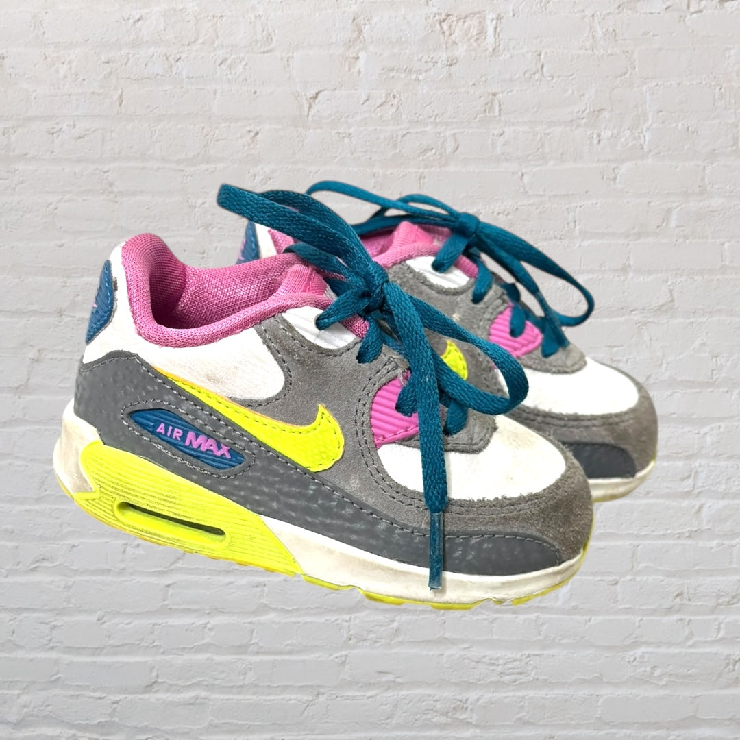 Nike Air Max kids' sneakers in gray, pink, and yellow with blue laces.
