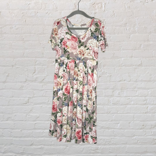 A multicolour floral print short-sleeve midi dress with a scoop neckline, hanging on a hanger.