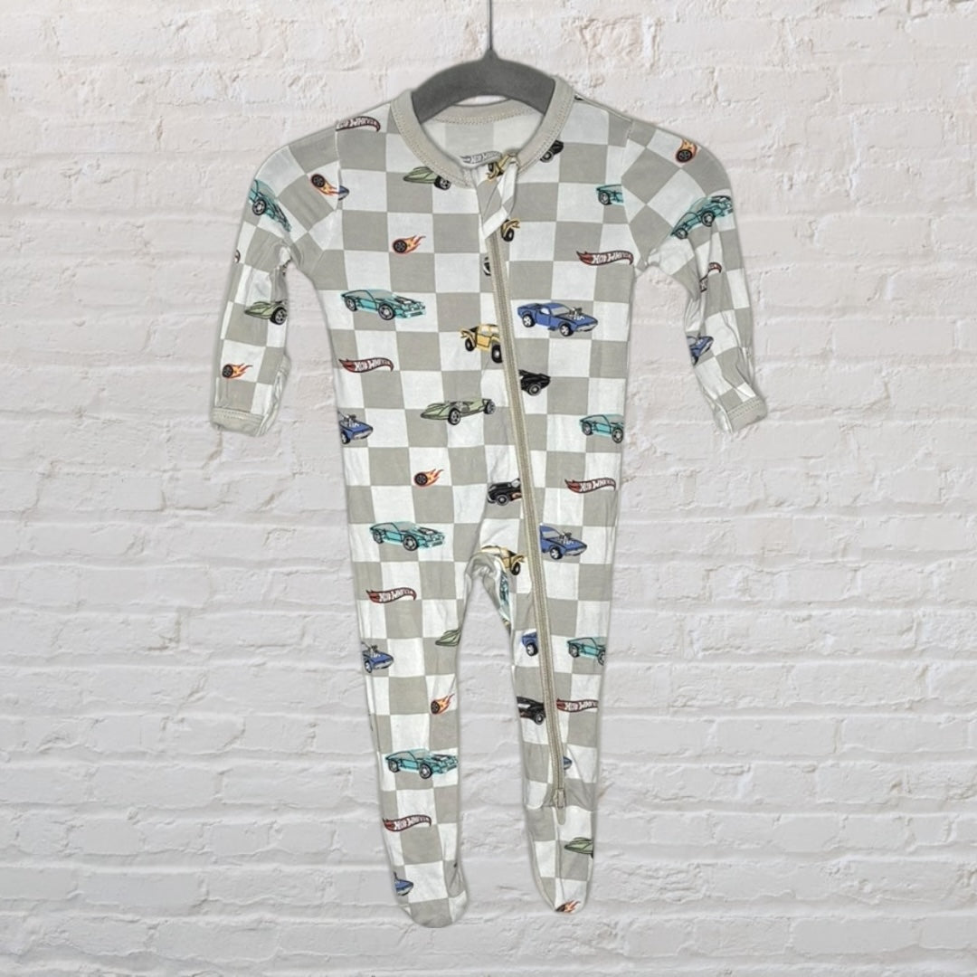 Unisex footed onesie with beige and grey checkered pattern and colorful car print hanging on a gray hanger.