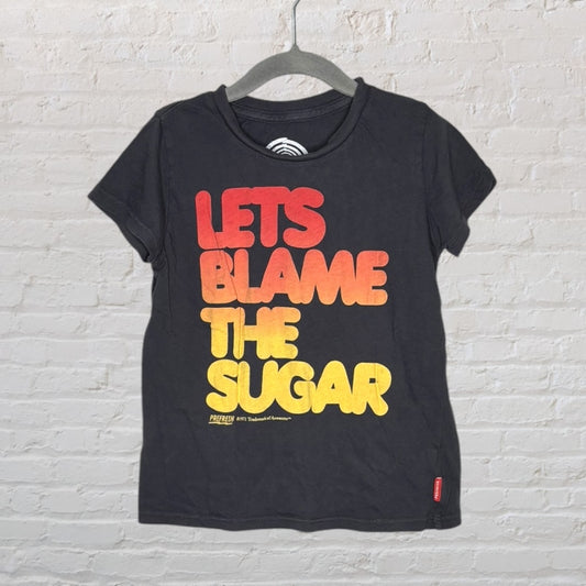 Black T-shirt with bold red to yellow gradient text 'Let's Blame the Sugar'.
