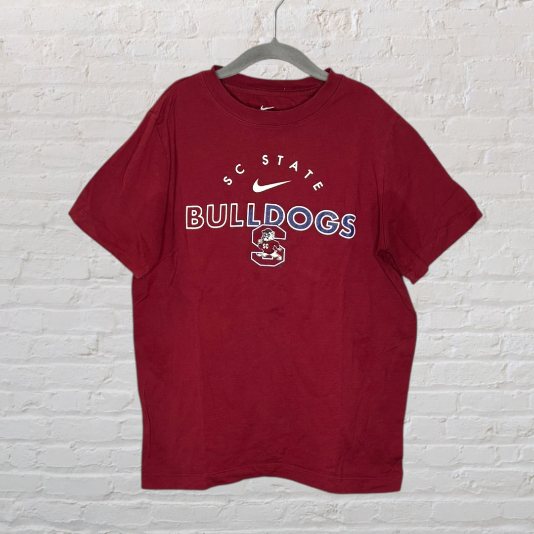 Maroon Nike T-shirt featuring SC State Bulldogs logo and text, hanging on a hanger.