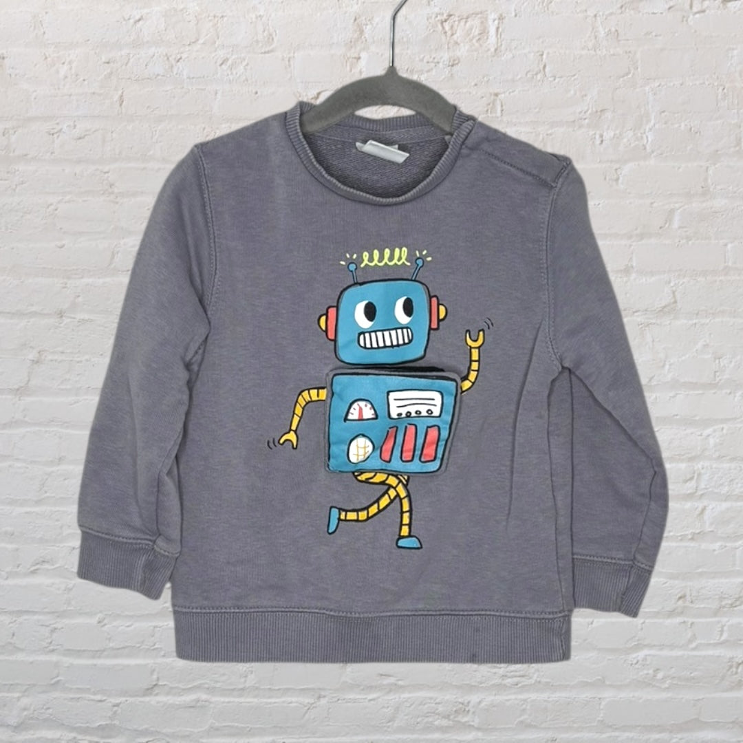 Grey sweatshirt featuring a colorful robot graphic on the front, hanging on a dark hanger.