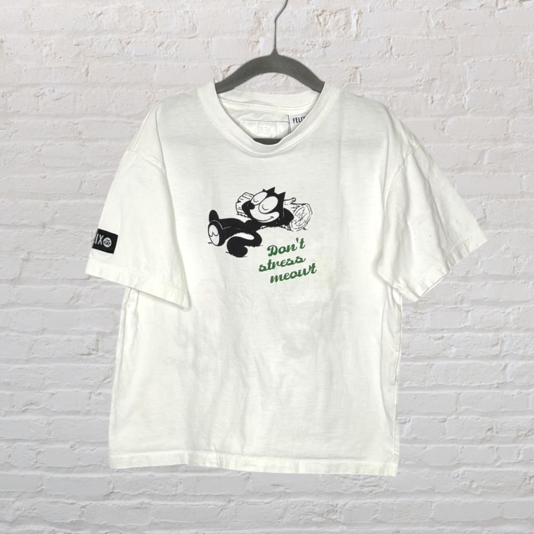 White T-shirt featuring a colorful graphic of Felix the Cat relaxing with trees and 'Felix... and relax' text.