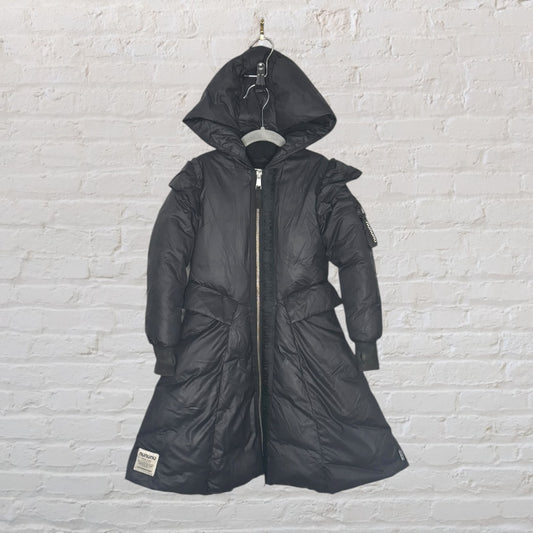 Black long quilted coat with hood and zip, featuring a Nununu patch on the hem.