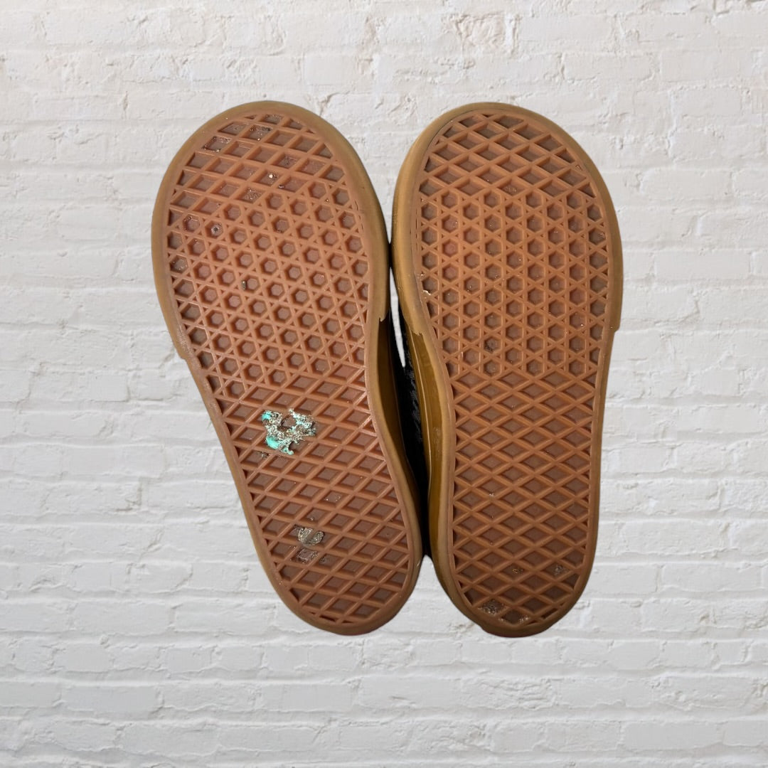 Checkered sneakers with velcro straps, featuring black and brown accents and a gum sole.