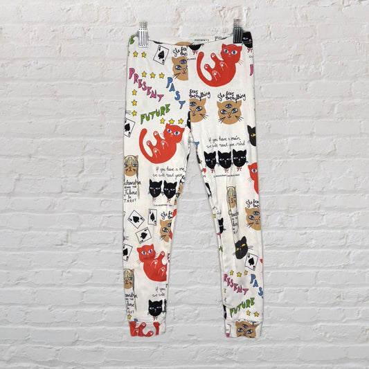 Leggings featuring a colorful tarot card design with cat illustrations and playful text.