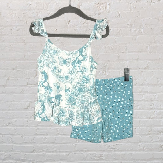 Women's floral print peplum top with ruffled straps and teal floral print shorts set displayed on a hanger.