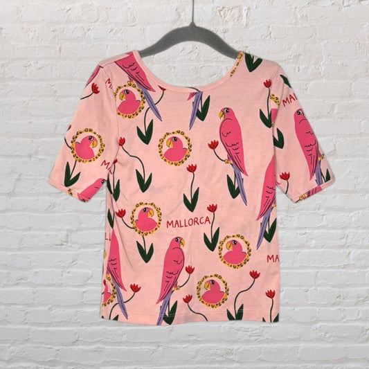 Pink T-shirt with a colorful parrot and floral design, featuring the text 'Mallorca'.