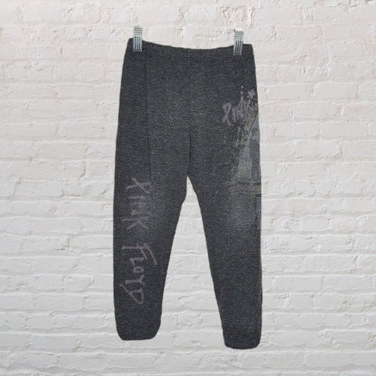Charcoal sweatpants with Pink Floyd graphic text on the left leg.