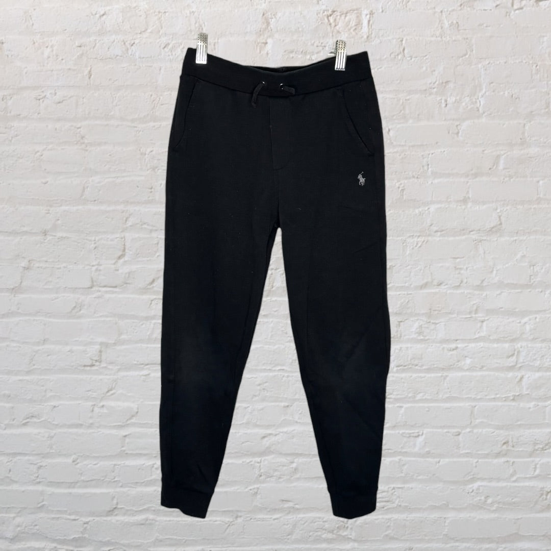 Black sweatpants with embroidered logo, featuring a drawstring waist and cuffs.