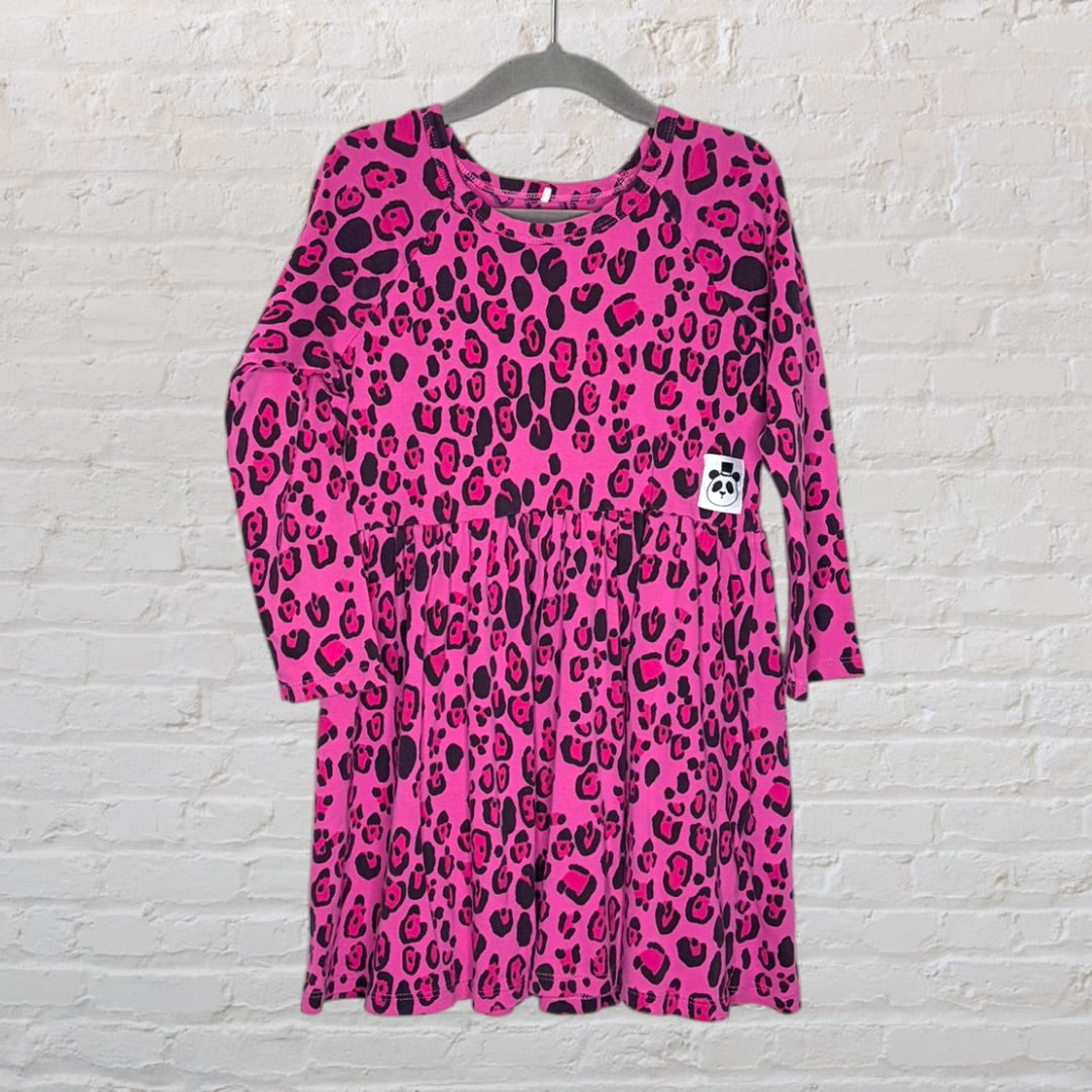Pink leopard print long sleeve dress with gathered waist and a small panda patch, hung on a hanger.
