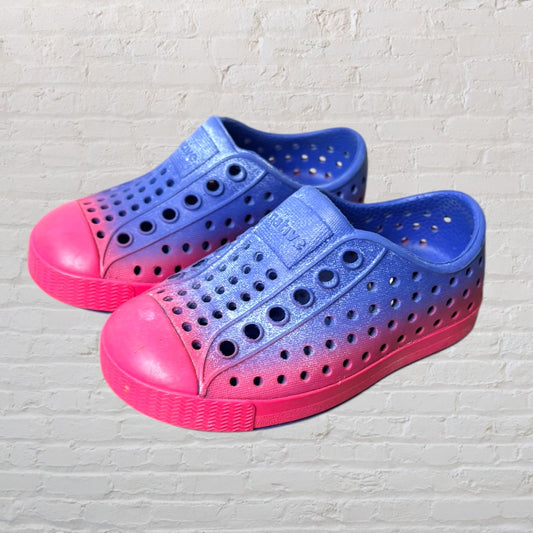 Blue and pink gradient slip-on perforated shoes by Native with a rubber sole.