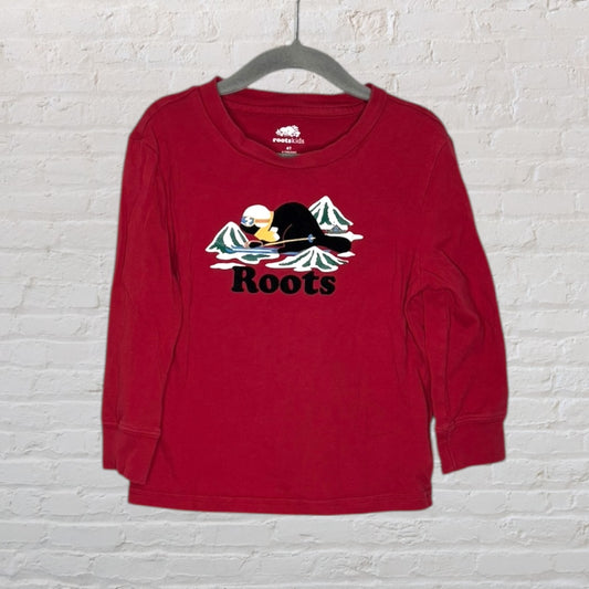Red long sleeve Roots Kids tee with a graphic of a beaver skiing in front of mountains.