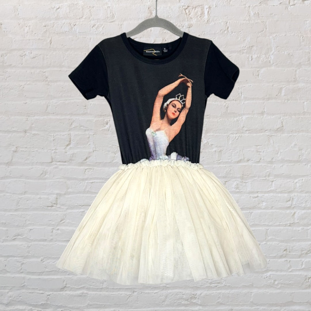 Tutu dress featuring a ballerina graphic on the black top with an ivory tulle skirt.