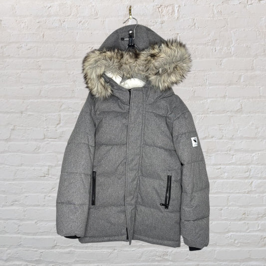 Grey padded puffer jacket with faux fur lined hood, displayed on a hanger.