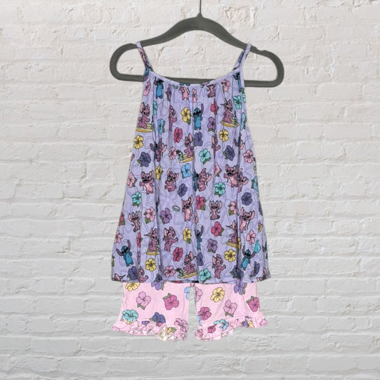 Purple and pink Disney sleepwear set with Stitch and floral print, featuring a top and shorts hanging on a hanger.