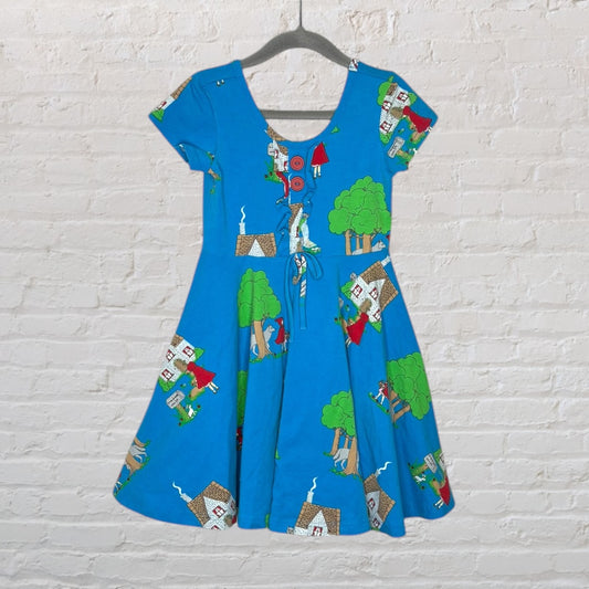 Blue vintage dress with a fairy tale print, featuring houses and trees, short sleeves, and a flared skirt.
