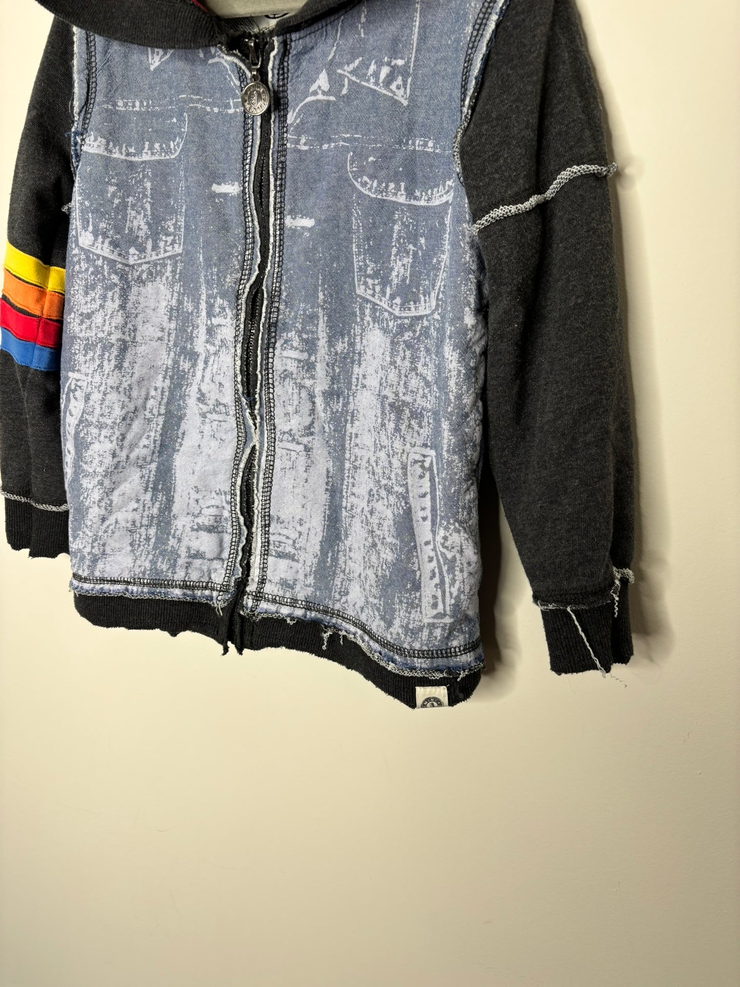 Black hoodie with denim-style print and colorful stripes on the sleeve, featuring a red lining and zip closure.