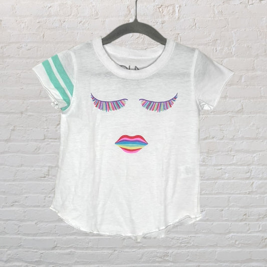 White T-shirt with colorful graphic of eyelashes and lips, and teal stripes on the sleeve.
