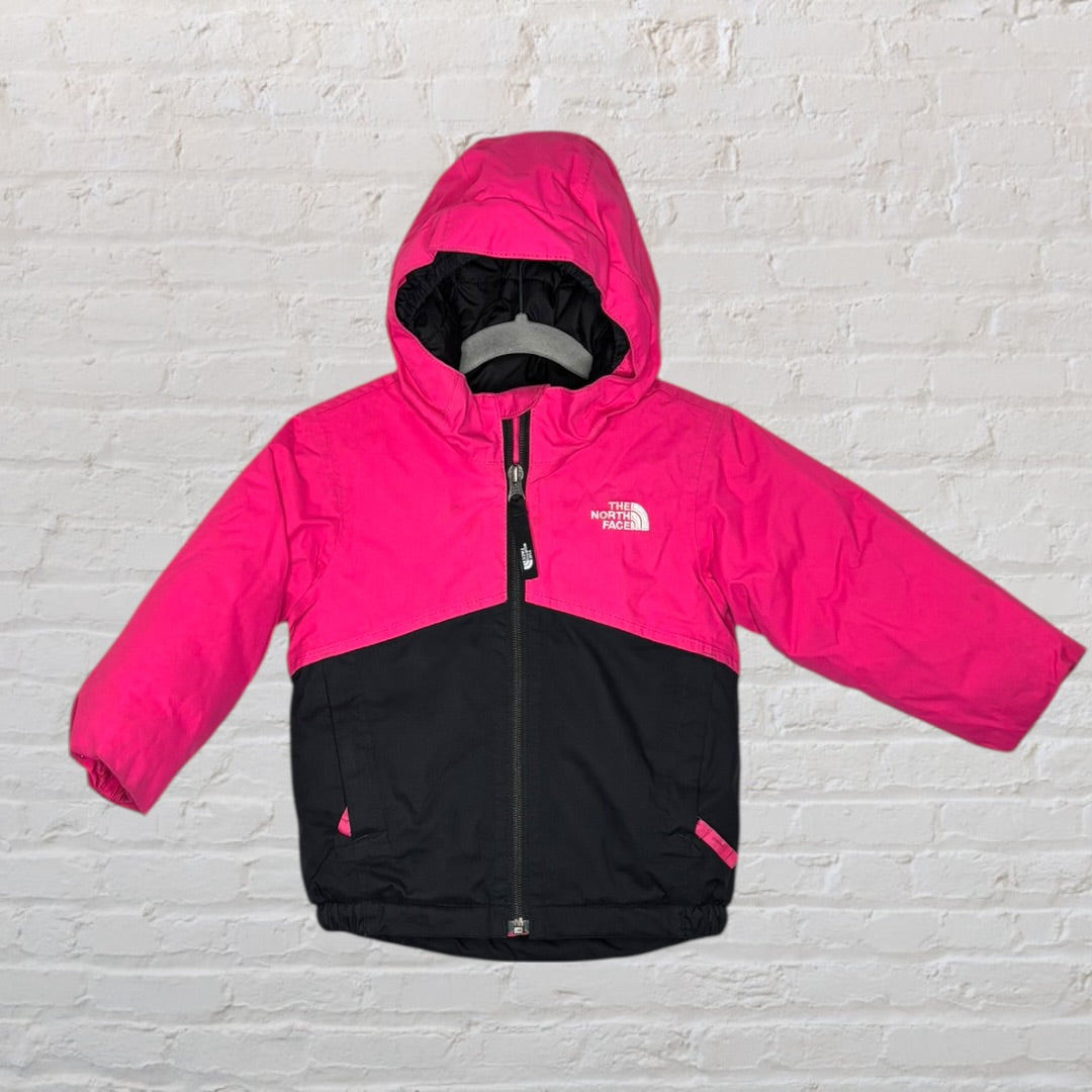 Pink and black hooded jacket by The North Face, designed for unisex wear, featuring a full zip and logo on the chest.