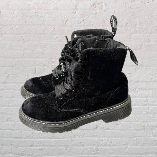 Black velvet lace-up boots with a pull tab and thick sole, showing some lint.