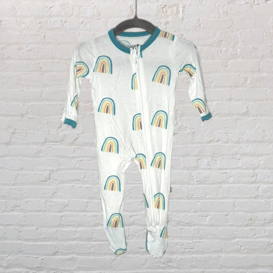 White baby sleeper with rainbow pattern and teal trim, featuring a front zipper, hanging on a hanger.