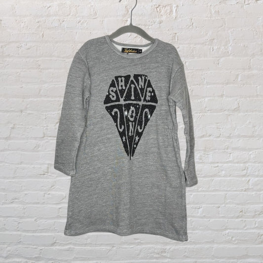 Grey long sleeve dress with 'Shine On' diamond graphic, by Lolly Banks, hanging on a hanger.
