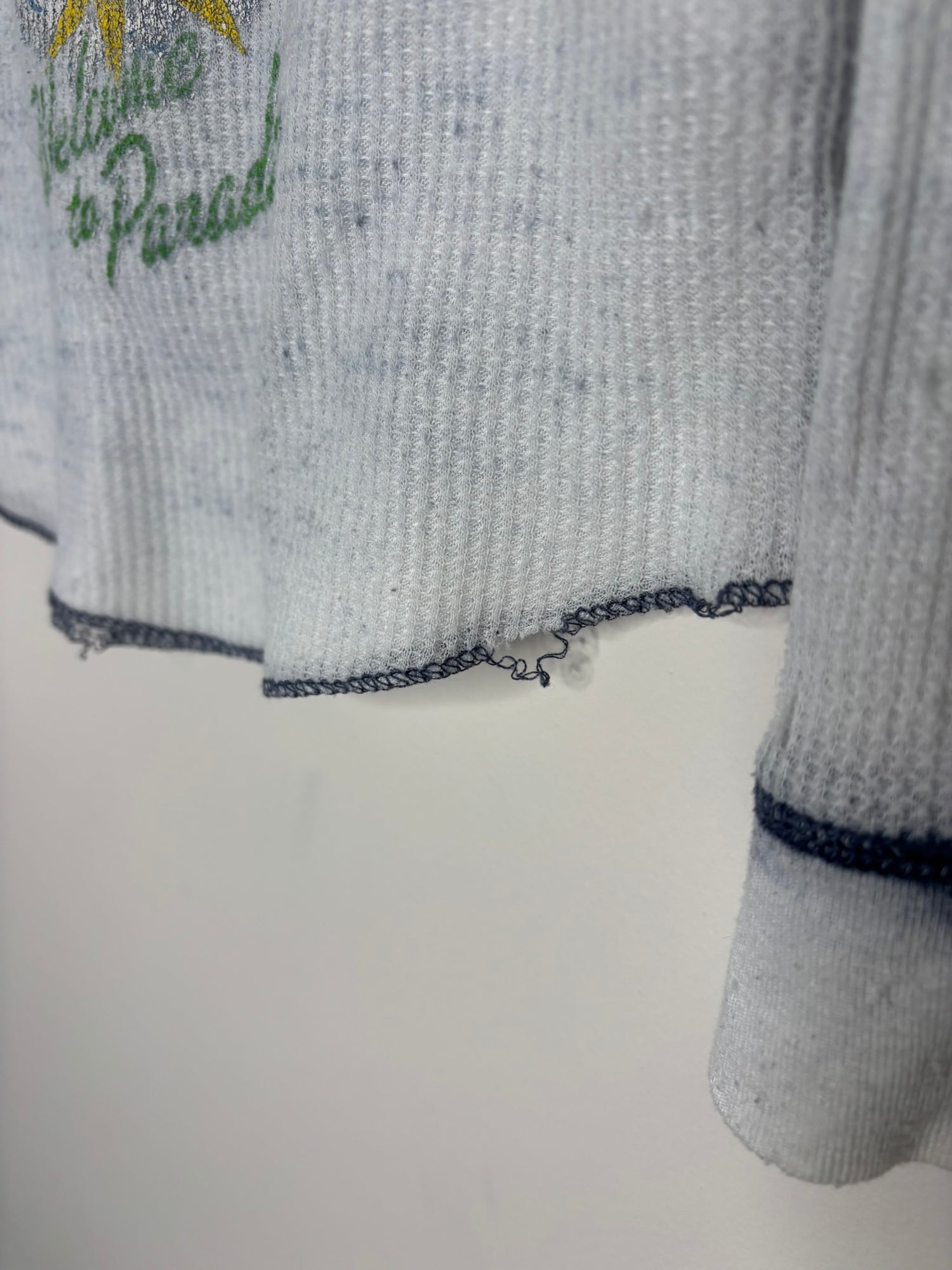 Gray thermal long sleeve shirt with Green Day 'Welcome to Paradise' graphic.