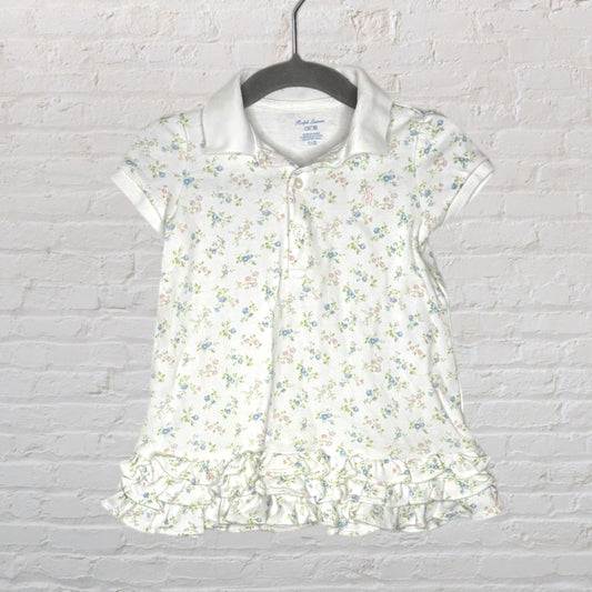 White Ralph Lauren polo shirt with floral print and ruffle hem design for kids.