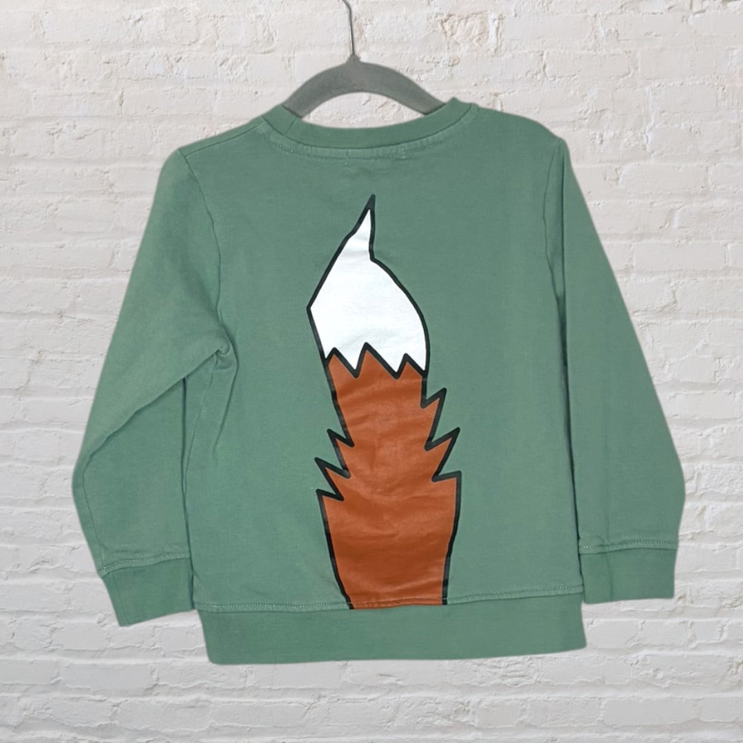 Green sweatshirt with a large fox graphic on the front, displayed on a hanger.