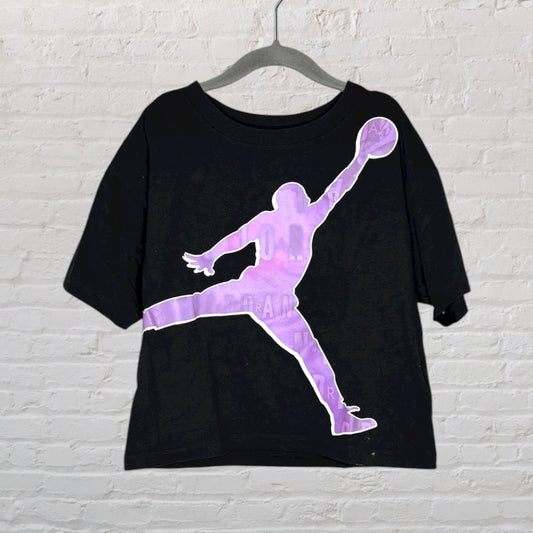 Black oversized T-shirt with a large purple basketball player silhouette graphic printed on the front.