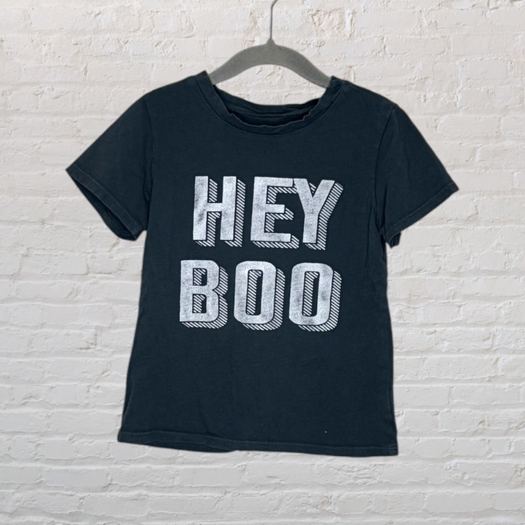 Black T-shirt with 'Hey Boo' text printed in bold white letters on a hanger.