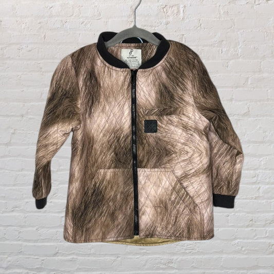Quilted bomber jacket with a brown faux fur pattern design, featuring black cuffs and collar, hanging on a hanger.