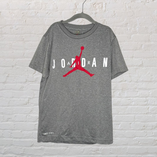Grey Jordan Dri-FIT T-shirt with red Jumpman logo and white lettering, hanging on a black hanger.