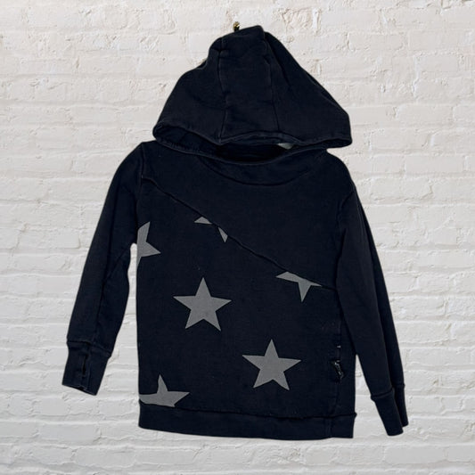 Black hoodie with diagonal grey star prints on the front, displayed against a white brick wall.