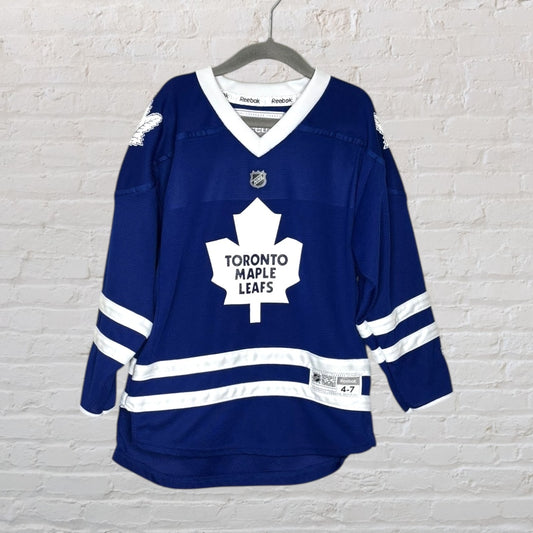 Blue and white Toronto Maple Leafs hockey jersey by Reebok, featuring the team's logo on the front, size 4-7.