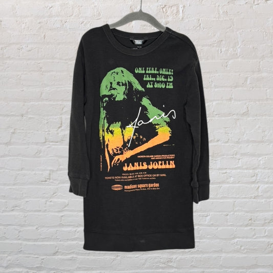 Black long-sleeve T-shirt with Janis Joplin concert graphic in green and orange, hanging on a hanger.