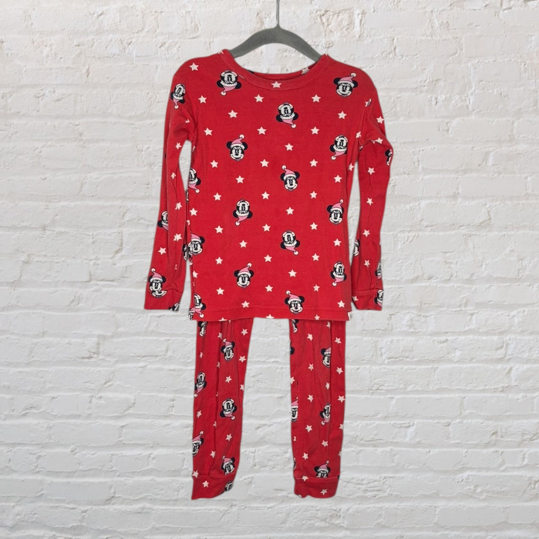 Red pajama set featuring Mickey Mouse and white stars, with long sleeves and pants, on a hanger.