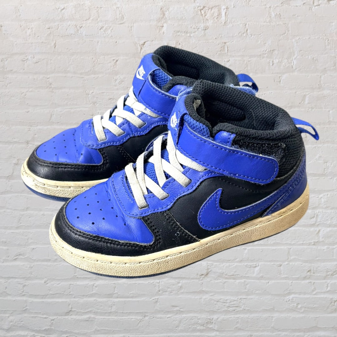 Blue and black Nike high-top sneakers with white laces and a slightly worn sole.