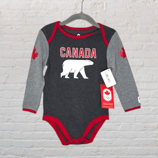 Grey and red baby bodysuit featuring 'Canada' text and a polar bear graphic, with red maple leaf on the sleeves, hanging on a hanger.