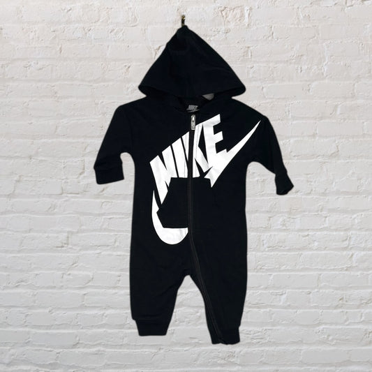 Black Nike hooded onesie with a large white Nike logo and zip closure.