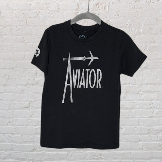Black T-shirt with large silver 'Aviator' text and airplane graphic, hanging on a hanger.