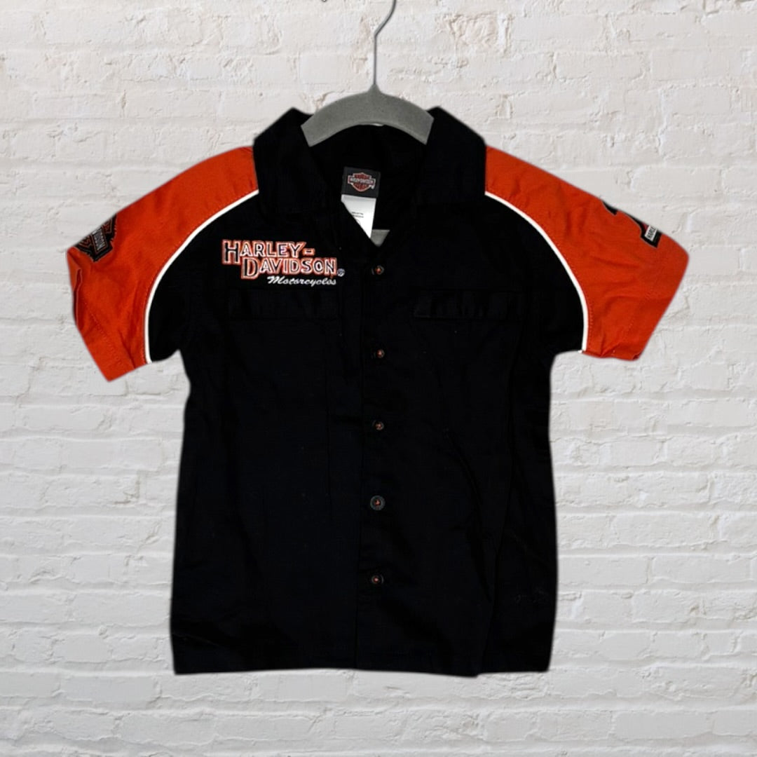 Black and orange Harley-Davidson shirt with embroidered logos and graphics, featuring short sleeves.